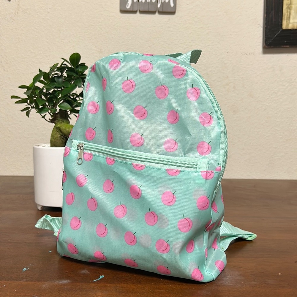 NWT Mini backpack blue with peaches design adjustable straps